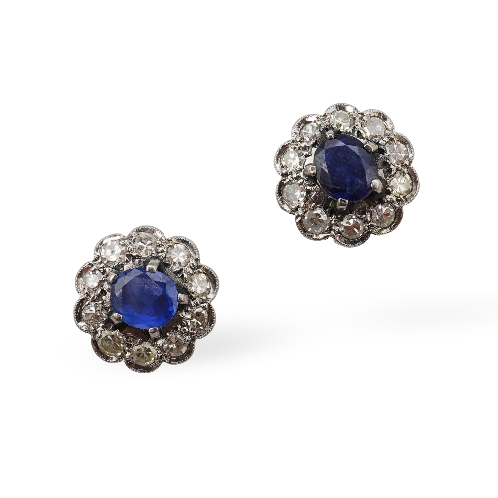 A pair of sapphire and diamond studs, mid 20th century